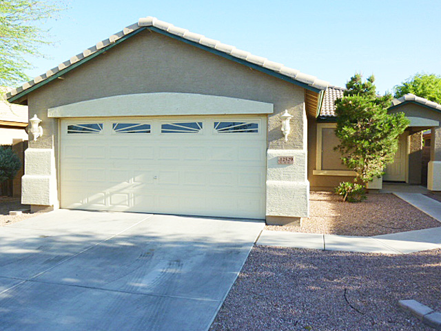 Two-car garage with built-in cabinets