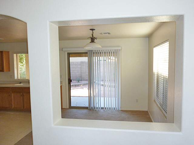 Looking through your formal dining room into your manicured backyard